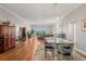 Elegant dining room with hardwood floors and modern light fixture at 12055 Gandy N Blvd # 243, St Petersburg, FL 33702