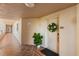 Building hallway with tile floors and access to unit 243 at 12055 Gandy N Blvd # 243, St Petersburg, FL 33702