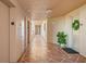 Clean and well-lit building hallway with tile floors at 12055 Gandy N Blvd # 243, St Petersburg, FL 33702