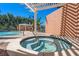 Community hot tub with pergola and surrounding lounge chairs at 12055 Gandy N Blvd # 243, St Petersburg, FL 33702