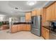 Modern kitchen with stainless steel appliances and light wood cabinets at 12055 Gandy N Blvd # 243, St Petersburg, FL 33702