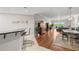 Open concept living area with hardwood floors and access to balcony at 12055 Gandy N Blvd # 243, St Petersburg, FL 33702