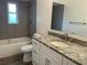 Clean bathroom with granite countertop and bathtub at 1311 4Th W St, Palmetto, FL 34221