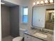 Updated bathroom with granite vanity and gray tile shower at 1311 4Th W St, Palmetto, FL 34221