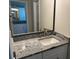 Updated bathroom with granite countertop, modern vanity, and updated fixtures at 1311 4Th W St, Palmetto, FL 34221