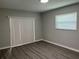 Bright bedroom with sliding glass doors and laminate flooring at 1311 4Th W St, Palmetto, FL 34221