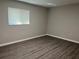 Simple bedroom with laminate flooring and window at 1311 4Th W St, Palmetto, FL 34221