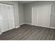Spacious bedroom with double door closets and laminate wood floors at 1311 4Th W St, Palmetto, FL 34221