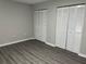Well-lit bedroom with double door closets and laminate floors at 1311 4Th W St, Palmetto, FL 34221
