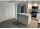 Updated kitchen with white cabinets, granite island and stainless steel appliances at 1311 4Th W St, Palmetto, FL 34221