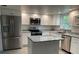 Updated kitchen featuring white cabinets, granite countertops and island at 1311 4Th W St, Palmetto, FL 34221