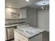 Modern kitchen with white cabinets, granite countertops and island at 1311 4Th W St, Palmetto, FL 34221