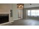 Bright living room featuring a fireplace and laminate wood floors at 1311 4Th W St, Palmetto, FL 34221