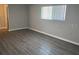 Living area with laminate flooring and neutral walls at 1311 4Th W St, Palmetto, FL 34221