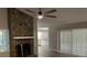 Living room with stone fireplace and view into the kitchen at 1311 4Th W St, Palmetto, FL 34221