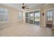 Gathering room with sliding doors to patio and ceiling fan at 307 Mystic Falls Dr, Apollo Beach, FL 33572