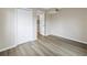 Bright bedroom with wood-look flooring and double door closet at 3500 Lake Bayshore Dr # K-101, Bradenton, FL 34205