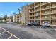Exterior view of an apartment building with parking spaces at 3500 Lake Bayshore Dr # K-101, Bradenton, FL 34205