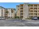 Exterior view of an apartment building with parking and landscaping at 3500 Lake Bayshore Dr # K-101, Bradenton, FL 34205