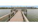 Wooden fishing dock on the lake with string lights at 3500 Lake Bayshore Dr # K-101, Bradenton, FL 34205