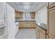 Modern kitchen with granite countertops and light wood cabinets at 3500 Lake Bayshore Dr # K-101, Bradenton, FL 34205