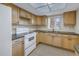 Bright kitchen with granite countertops and light wood cabinets at 3500 Lake Bayshore Dr # K-101, Bradenton, FL 34205