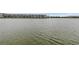 Serene lake view with community buildings in background at 3500 Lake Bayshore Dr # K-101, Bradenton, FL 34205