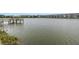 Tranquil lake view with community buildings at 3500 Lake Bayshore Dr # K-101, Bradenton, FL 34205