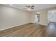 Open living area with wood-like floors and kitchen access at 3500 Lake Bayshore Dr # K-101, Bradenton, FL 34205