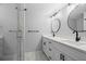 Updated bathroom with double vanity, modern fixtures, and glass shower at 3505 Tarpon Woods Blvd # K403, Palm Harbor, FL 34685
