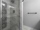 Updated bathroom with marble shower and modern fixtures at 3505 Tarpon Woods Blvd # K403, Palm Harbor, FL 34685