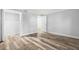 Bedroom with wood-look floors and access to closet at 3505 Tarpon Woods Blvd # K403, Palm Harbor, FL 34685