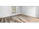 Well-lit bedroom featuring wood-look floors at 3505 Tarpon Woods Blvd # K403, Palm Harbor, FL 34685