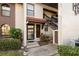 Front entrance of villa with stairs and landscaping at 3505 Tarpon Woods Blvd # K403, Palm Harbor, FL 34685