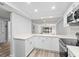 Modern kitchen with white cabinets and quartz countertops at 3505 Tarpon Woods Blvd # K403, Palm Harbor, FL 34685