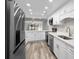 Modern kitchen with white cabinets and stainless steel appliances at 3505 Tarpon Woods Blvd # K403, Palm Harbor, FL 34685