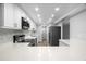 Modern kitchen with white cabinets, stainless steel appliances and quartz countertops at 3505 Tarpon Woods Blvd # K403, Palm Harbor, FL 34685