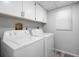 Laundry room with washer, dryer, and cabinets at 3505 Tarpon Woods Blvd # K403, Palm Harbor, FL 34685