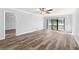 Bright living room with vinyl flooring and sliding glass doors at 3505 Tarpon Woods Blvd # K403, Palm Harbor, FL 34685