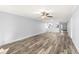 Spacious living room featuring wood-look floors and ceiling fan at 3505 Tarpon Woods Blvd # K403, Palm Harbor, FL 34685