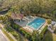 Community pool and spa with lounge chairs at 3505 Tarpon Woods Blvd # K403, Palm Harbor, FL 34685