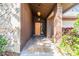 Covered entryway with terracotta tile and orange door at 4595 Northwood Ter, Sarasota, FL 34234
