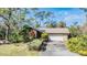 House with a large driveway and lush landscaping at 4595 Northwood Ter, Sarasota, FL 34234