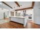 Modern kitchen with white cabinets and quartz island at 4595 Northwood Ter, Sarasota, FL 34234