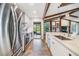 Modern kitchen with stainless steel appliances and access to backyard at 4595 Northwood Ter, Sarasota, FL 34234