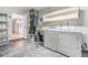 Laundry room with washer, dryer, and extra shelving at 4595 Northwood Ter, Sarasota, FL 34234