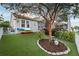Artificial turf backyard with landscaping and kayaks at 805 Islebay Dr, Apollo Beach, FL 33572