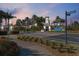 MiraBay community entrance with gated access, palm trees, and streetlights at 805 Islebay Dr, Apollo Beach, FL 33572
