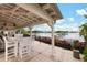 Relaxing waterfront patio with seating and lake views at 805 Islebay Dr, Apollo Beach, FL 33572