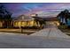 Charming two-story home with a large front porch and driveway at 805 Islebay Dr, Apollo Beach, FL 33572
